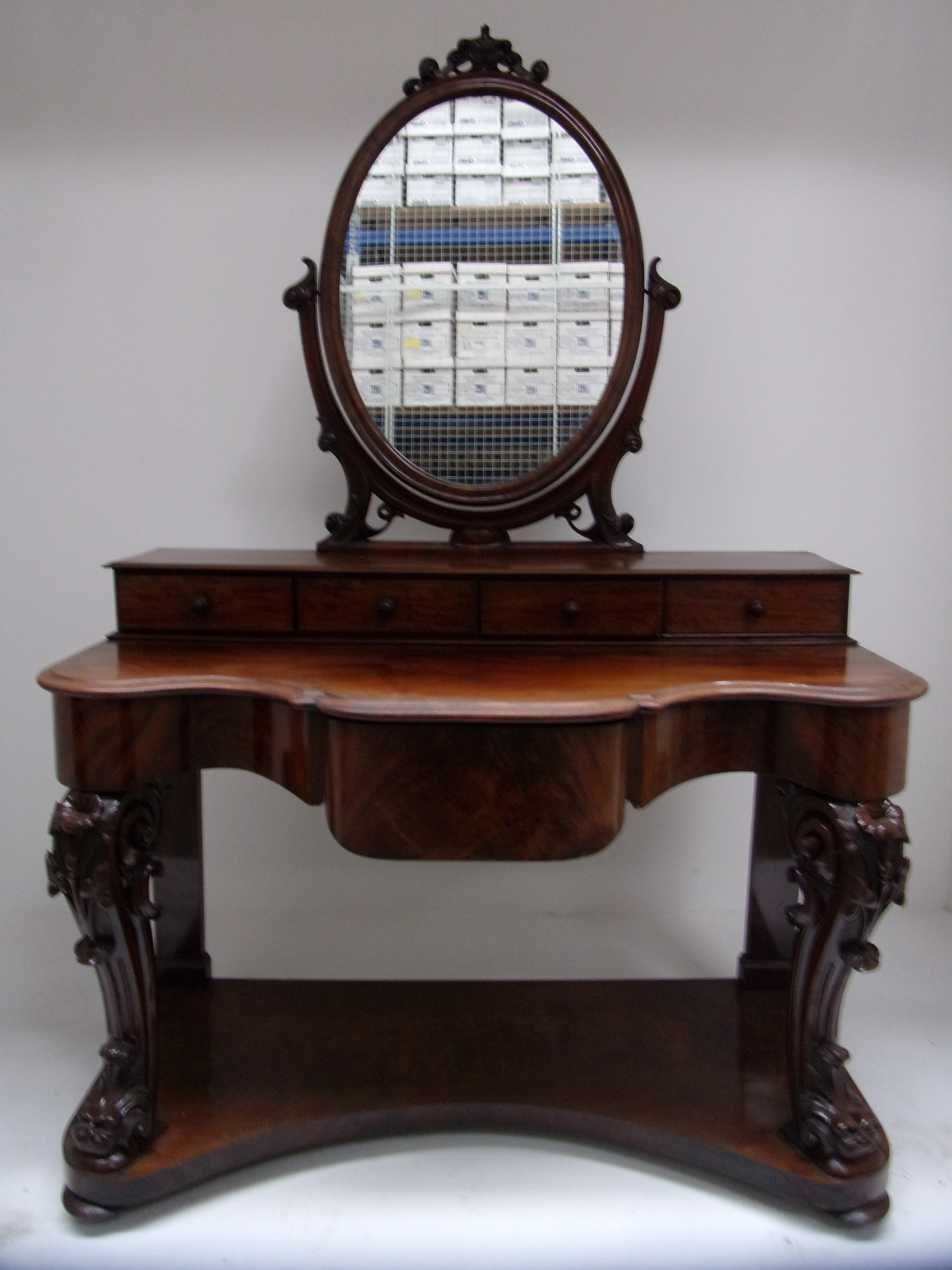 A Victorian mahogany Duchess dressing table with oval mirror over four drawers, shaped front and - Image 4 of 4