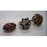 A 9ct gold diamond and sapphire cluster ring in flower head setting and two others [total