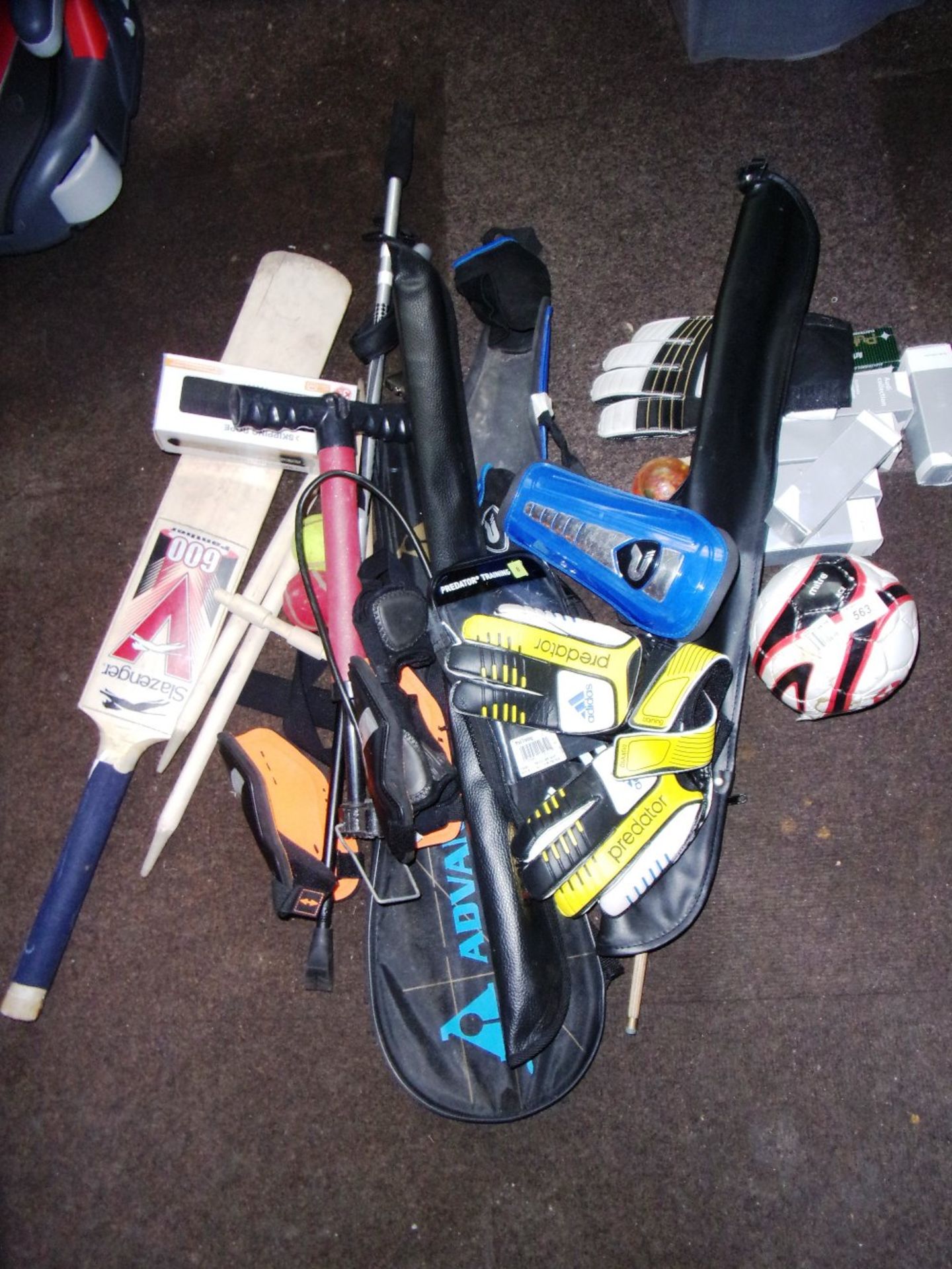 Quantity of assorted sports equipment - golf balls, cricket bat, etc.