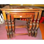 A nest of three oak coffee tables