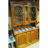 An oak wall unit with 2 upper leaded glazed door over 2 door base 120 x 200cm high