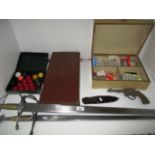 Two reproduction swords, a metal toy gun, a set of miniature snooker balls, a small knife,