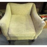 A light green upholstered armchair with outcurved arms