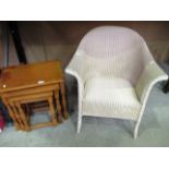 Lloyd Loom armchair and an oak nest of 3 tables