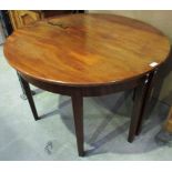 An early 19th century mahogany two section circular dining table on square tapered legs - 110 cm.