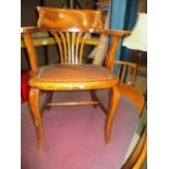 A stained mahogany captains style office armchair