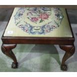 Walnut stool with embroidered top on claw and ball feet