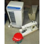 A LF320 mobile air cooler and a New Home table top sewing machine with foot pedestal (needs