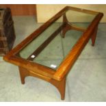 A rectangular coffee table with glass top