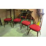 A set of 4 Ercol railback dining chairs (1 x arm) with red pad seats