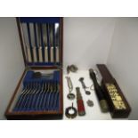 A 24 piece canteen of cutlery in oak case, a set of dominoes in case, a small truncheon,