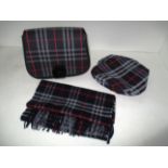A Burberry ladies blue tartan patterned bag with matching hat and scarf
