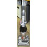 A Dyson upright vacuum cleaner