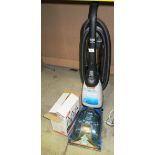 A Vax Rapide wet & dry vacuum cleaner complete with 3 bottles of machine carpet cleaner