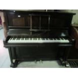 An Archibald Ramsden Ltd., London, straight strung piano in dark mahogany case, 134 cm.