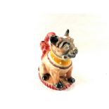 A pottery Pug dog doorstop with handle