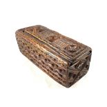 An 18th Century English North Country carved wooden box with sliding lid