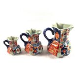 A set of three reproduction graduated Stoneware jugs