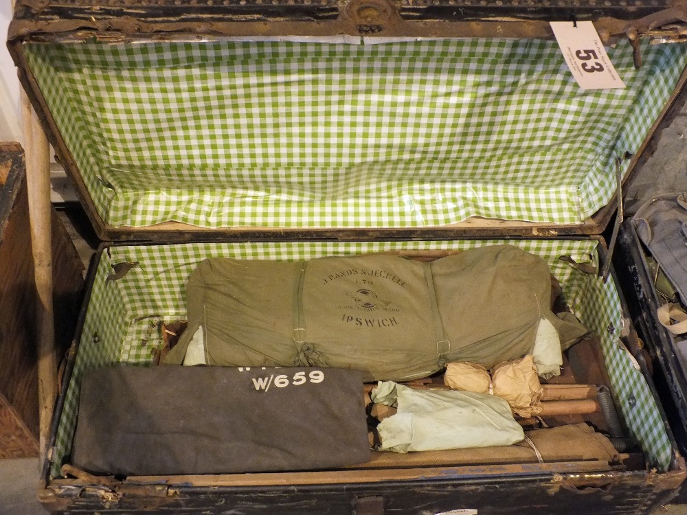 A vintage trunk with contents, including