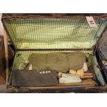 A vintage trunk with contents, including