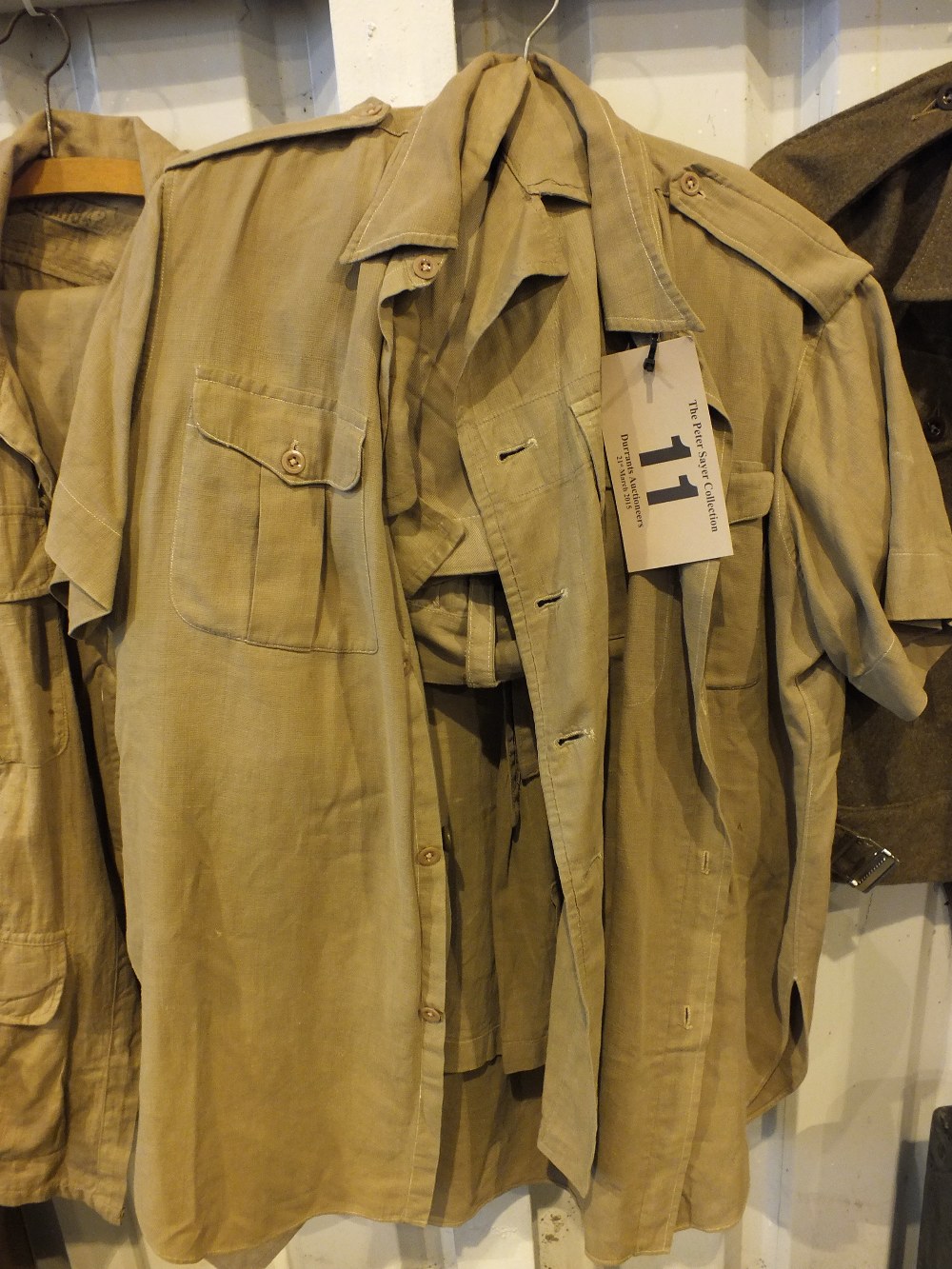 Two khaki drill shirts and a pair of sho