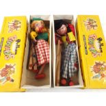 Two boxed Pelham Dutch boy and girl pupp