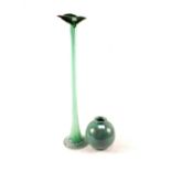 A tall green glass orchid vase and a gre