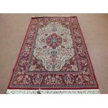 A machine made Persian style red floral