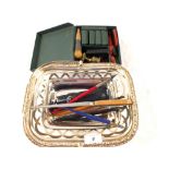 A Silver plated basket containing pens, wax seal set, etc