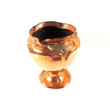 An Arts and Crafts embossed Copper jardinière with pedestal base, height 12"