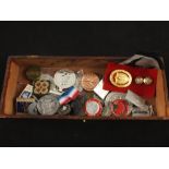 Small box containing various badges and medals