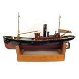 A wooden model of a fishing vessel,