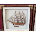 Two framed half hulls of sailboats "Cutty Sark" and "Mayflower"