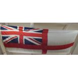 A large military marked white ensign flag