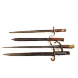 Four bayonets including WWI Turkish, WWI German butchers, a French bayonet and one other,