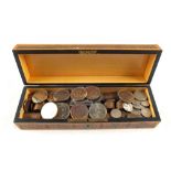 A wooden box containing old pennies,