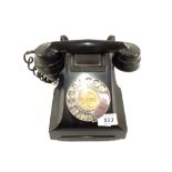 A black Bakelite telephone