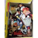 A box of various dolls including older costume dolls