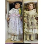 Two boxed Knightsbridge Collection porcelain dolls