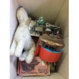 A childs sewing machine, travelling iron and a stuffed dog,