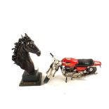 A model Norton motor cycle and a resin horse head