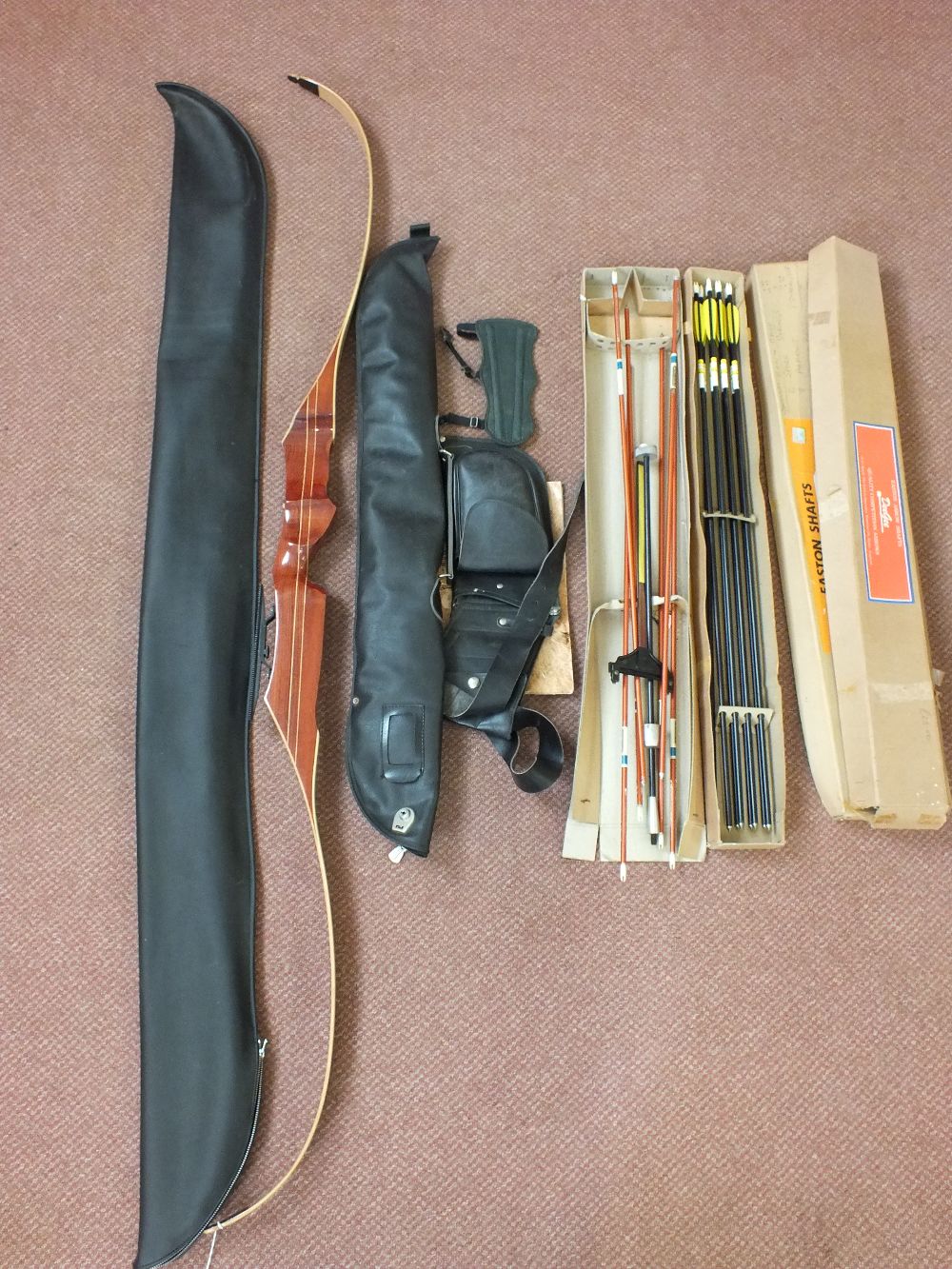 A quantity of archery equipment including a bow,