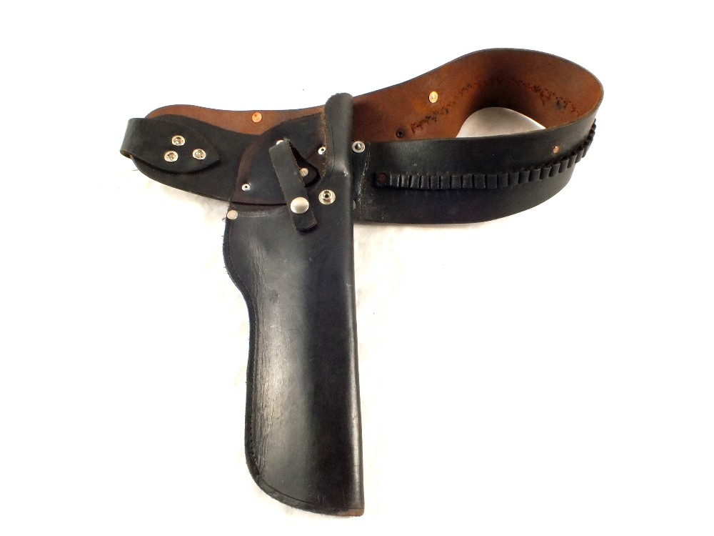 A black leather pistol holster with belt including .22 cal.