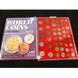 A Lindner tray containing world coins and a 2011 catalogue