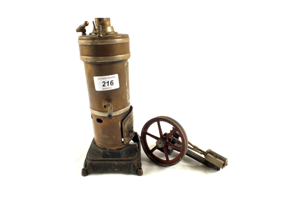 A Brass vertical steam engine and a flywheel accessory (no burner)