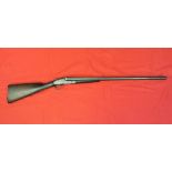 A 12 bore side-by-side shotgun by Holloway B.L.N.E. with 28" barrels fitted by Darlows of Norwich.