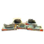 Hanging packs of Dinky models, 676 Daimler armoured car, 281 hovercraft, 691 striker anti tank,