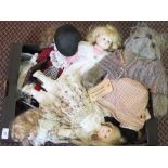 A box of various dolls