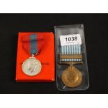 A boxed Imperial Service medal with a United Nations (Korea) medal