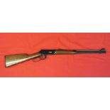 A Winchester model 94 lever action rifle in 30/30 cal.